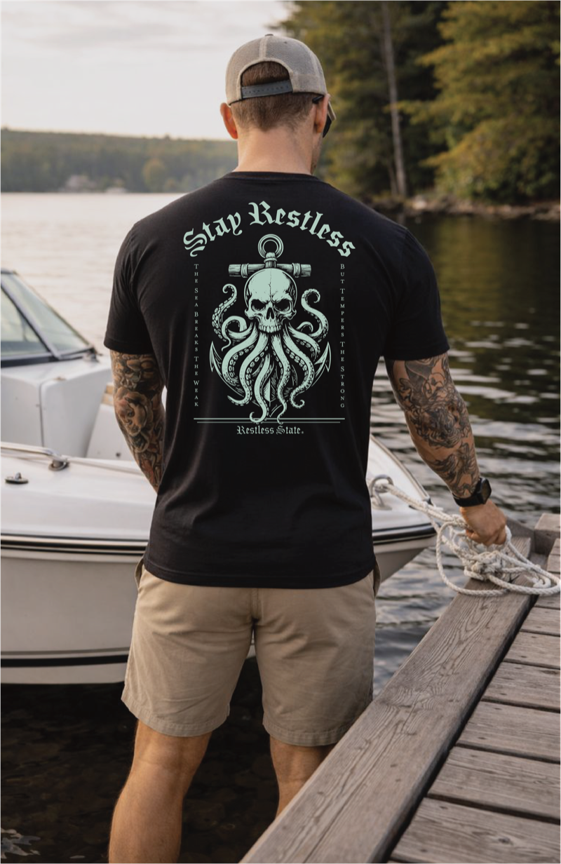 Man at dock marina wearing Kraken tee