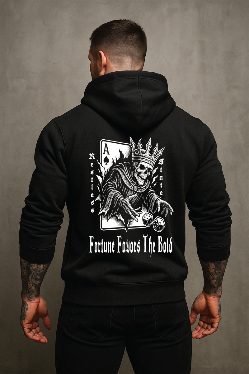 Hooded figure in dark warehouse