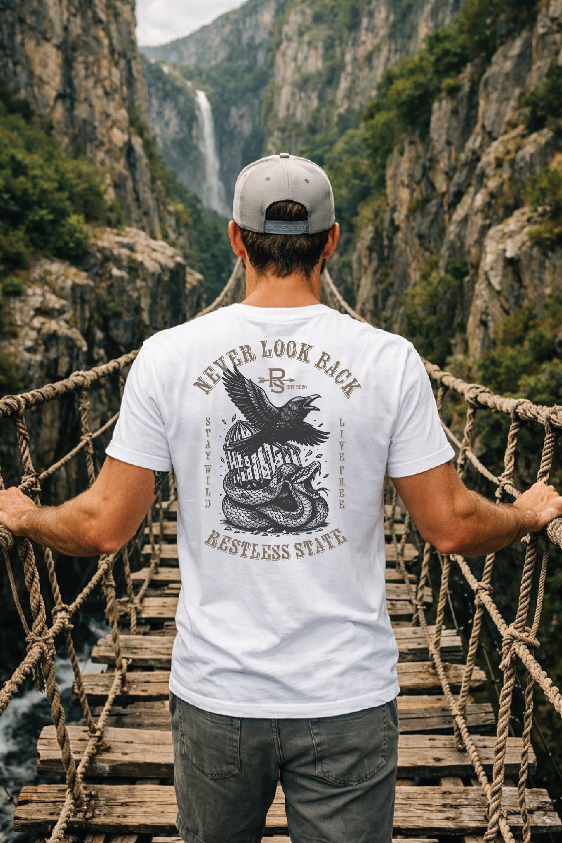 Never Look Back tee on rope bridge with waterfall