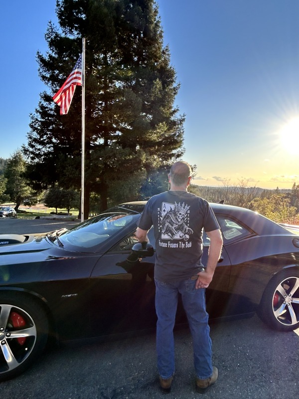 Man with Challenger and American flag